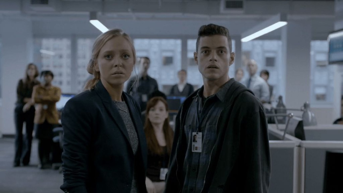 Mr. Robot: two characters in an office, cool and flat