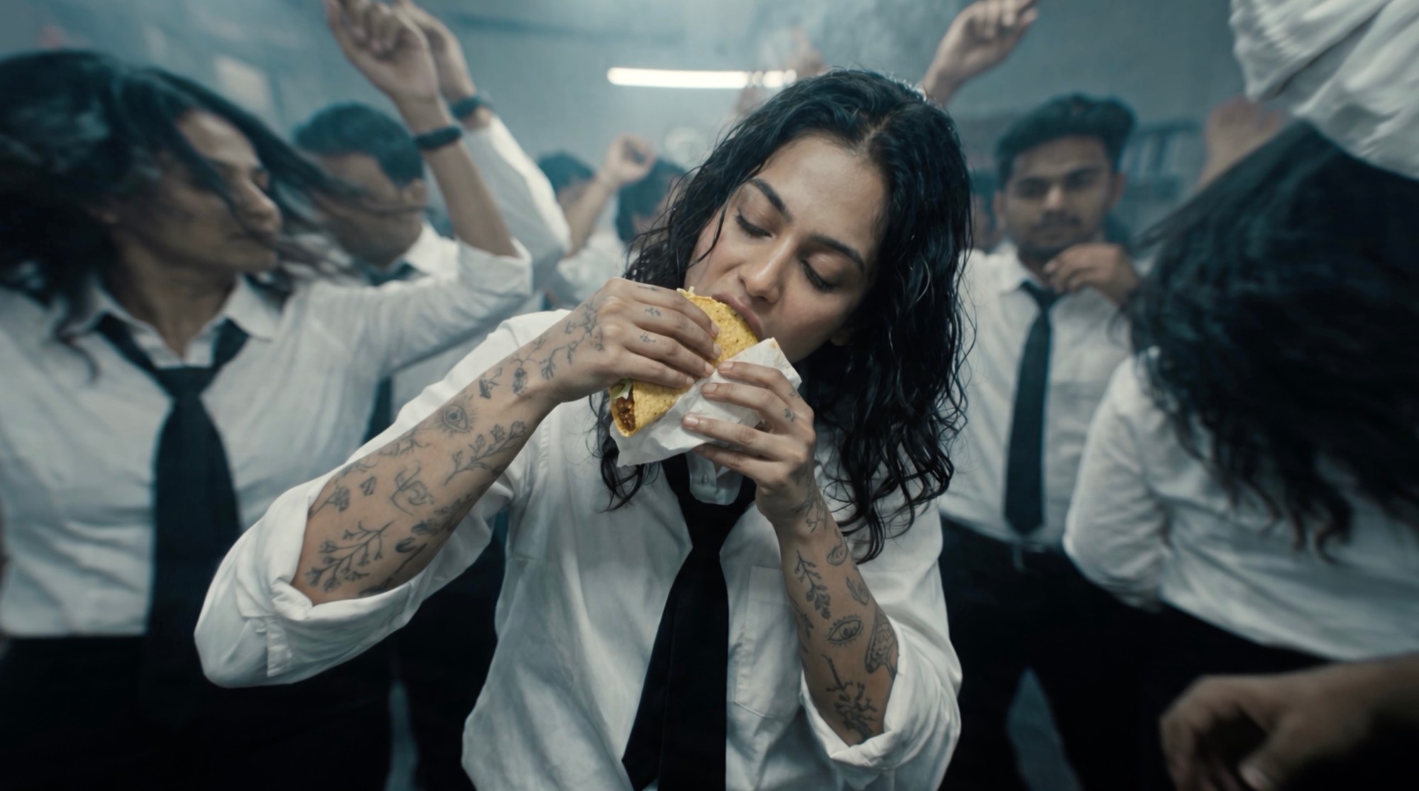 Dancing with a taco in hand, mid-party